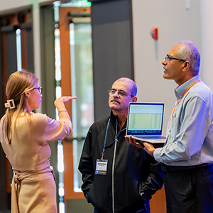 conference sponsors speak with attendee